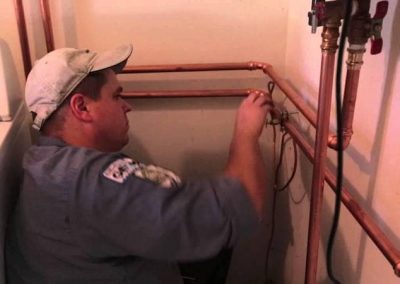 Plumber with copper tubing